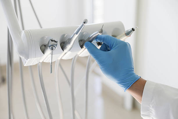 Professional Tooth Extraction technician working in Melville, RI
